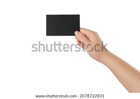 Young woman hand holding black business card isolated on white background.
