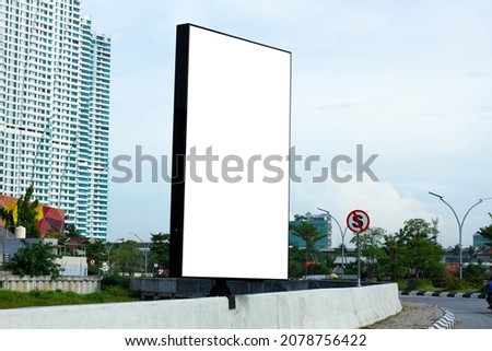 Large blank billboard for urban customization, perfect for commercial or editorial use