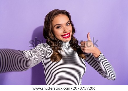 Photo of young woman happy positive smile make selfie show thumb-up like cool advert advice isolated over violet color background