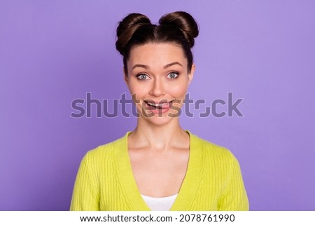 Photo of young attractive charming happy smiling positive flirty woman stick tongue out isolated on purple color background