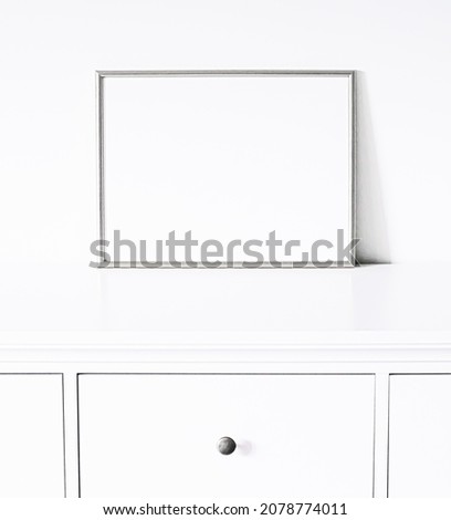 Silver frame on white furniture, luxury home decor and design for mockup, poster print and printable art, online shop showcase.