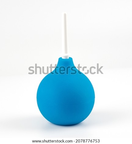 blue enema with white plastic cap isolated on white background.  Royalty-Free Stock Photo #2078776753