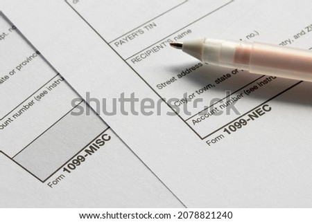 Closeup of Form 1099-NEC and 1099-MISC. The IRS has reintroduced Form 1099-NEC as the new way to report self-employment income instead of Form 1099-MISC as traditionally had been used. Royalty-Free Stock Photo #2078821240