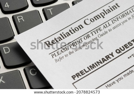 Closeup of a workplace retaliation complaint form. Royalty-Free Stock Photo #2078824573
