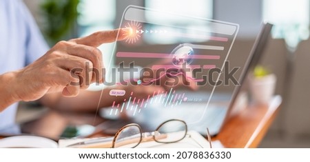 Asian man connects cloud computing by touching a virtual screen to an online database and automating processes. Search Engine Optimization technology