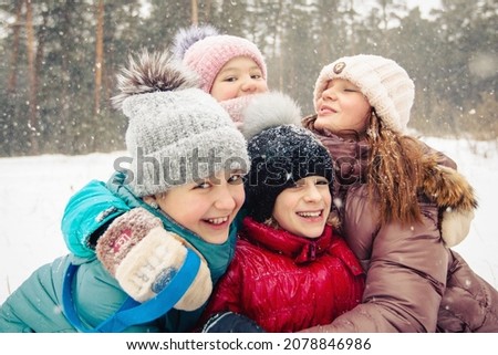 children playing outside snow winter laughter happy holiday 