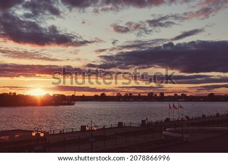 River Embankment in Kazan, Russia. The sky at sunset. Clouds at sunset. Blue and orange sky