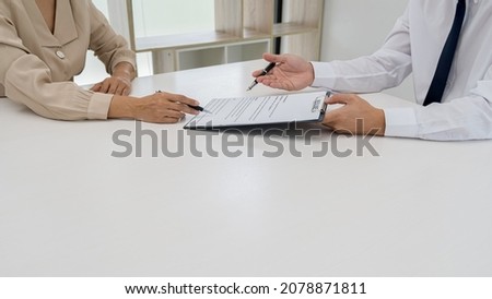 Attractive young business woman in a job interview with a corporate personnel manager.
