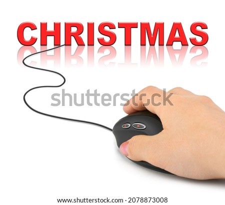 Hand with computer mouse and Christmas - holiday concept