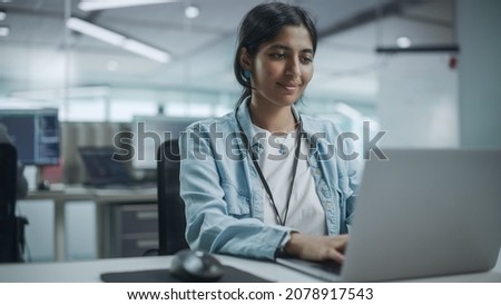 Diverse Office: Portrait of Beautiful Smiling Indian IT Programmer Working on Desktop Computer. Female Specialist Creating Innovative Software. Professional Engineer Develop Inspirational App Royalty-Free Stock Photo #2078917543