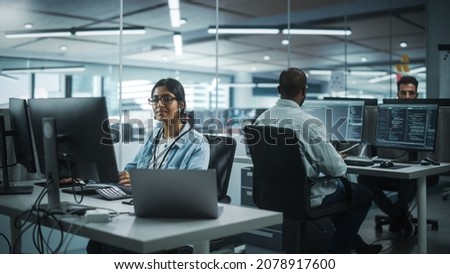 Diverse Office: Portrait of Talented Indian Girl IT Programmer Working on Desktop Computer in Friendly Multi-Ethnic Environment. Female Software Engineer Wearing Glasses Develop Inspirational App Royalty-Free Stock Photo #2078917600