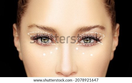 Lower and upper  Blepharoplasty.Marking the face.Perforation lines on females face, plastic surgery concept. Royalty-Free Stock Photo #2078921647