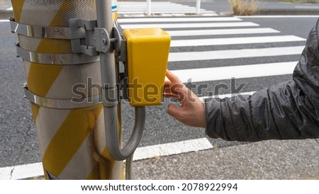 Push button signal. Pedestrians and pedestrian crossings.