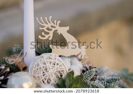 Christmas table decoration with candles. White table arrangement.
