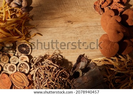 Traditional chinese medicine with herb and spices in brown wooden background and blankspace for medicine advertising , photography traditional medicine content