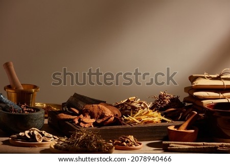 Traditional chinese medicine with herb and spices in light a grey background , for medicine advertising , photography traditional medicine content Royalty-Free Stock Photo #2078940466