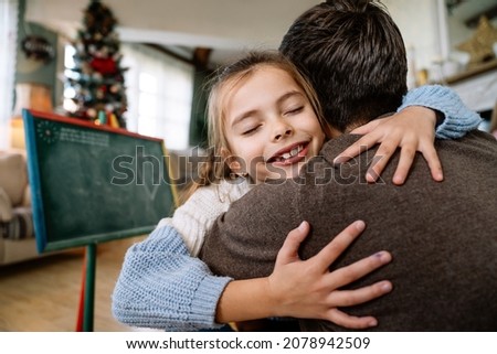 Happy family and father's day. Father and his daughter hugging and having fun together