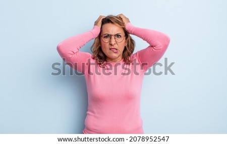middle age woman feeling frustrated and annoyed, sick and tired of failure, fed-up with dull, boring tasks Royalty-Free Stock Photo #2078952547