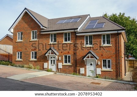 New build houses in UK. Modern new build in purpose built housing estate. Property ladder concept for housing market. Royalty-Free Stock Photo #2078953402