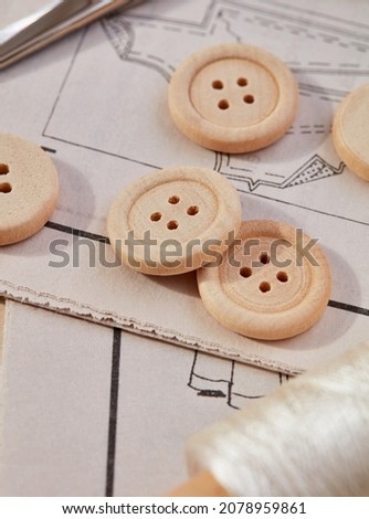 Sewing thread, buttons and pattern