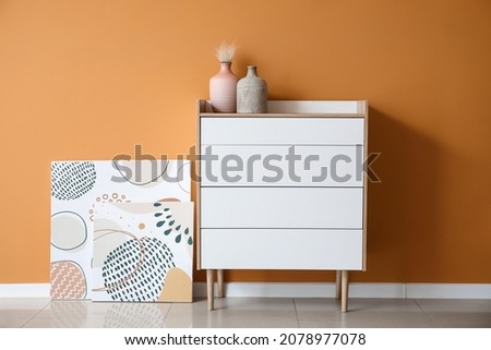 Interior of beautiful stylish room with chest of drawers