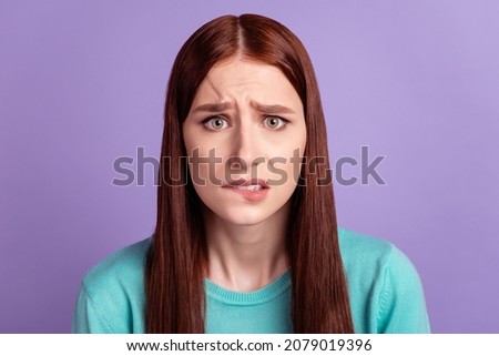 Photo of young lady bite lips teeth worried nervous stressed failure isolated over violet color background