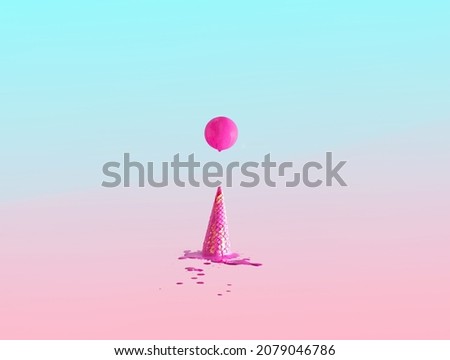 Hot pink painted ball floating above ice cream crunchy cone. Creative summer composition against pastel background.