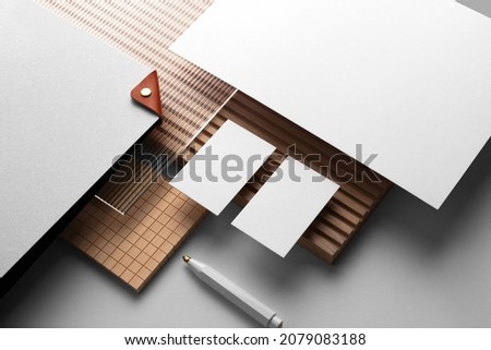 Branding stationery mockup template, with reeded glass and wooden elements, real photo, letterhead, folder, brochure, business card, envelope. Blank isolated on white background to place your design.  Royalty-Free Stock Photo #2079083188