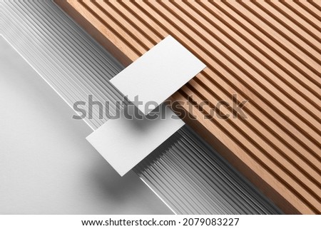 Branding stationery mockup template, with reeded glass and wooden elements, real photo,  business cards. Blank isolated on a white background to place your design.  Royalty-Free Stock Photo #2079083227