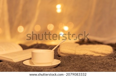Coffee is in front of the window at night