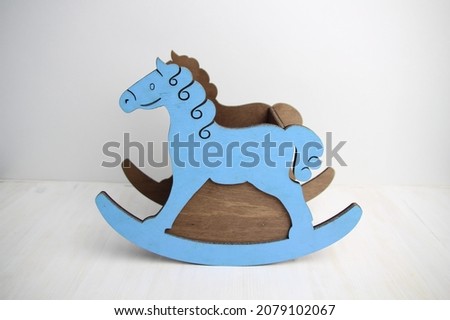 blue wooden rocking horse box on white background