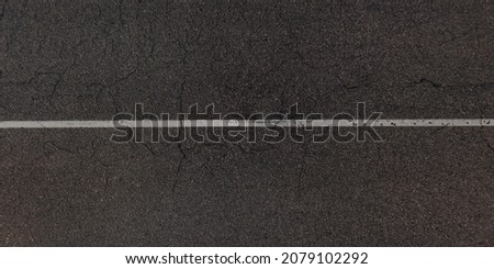 view from above on surface texture of old asphalt road with cracks Royalty-Free Stock Photo #2079102292