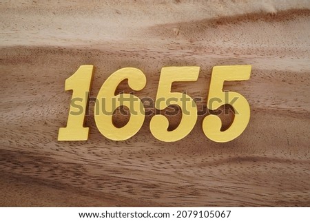 Golden Arabic numerals 1655 on a dark brown to white wood grain background.