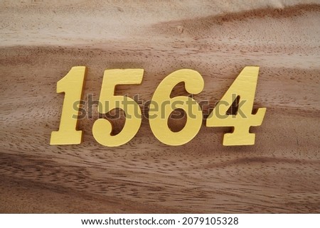 Golden Arabic numerals 1564 on a dark brown to white wood grain background.
