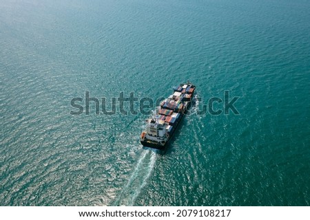 containers ship in import export cargo logistics Transportation international and worldwide in sea fright, business services and industrial mode of transport concept aerial view from drone 