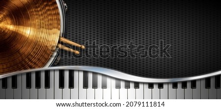 Musical instruments background on black background with copy space, golden cymbal on a snare drum with two wooden drumsticks and a piano keyboard with reflections.