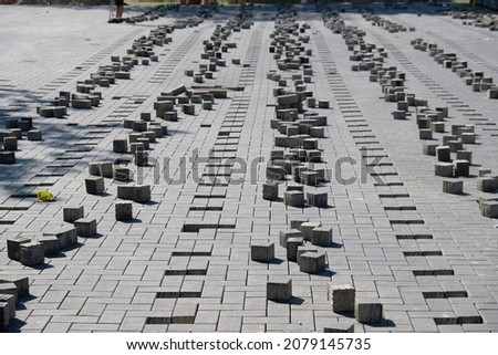 sorted paving stones are lying on the floor for the purpose of incorporation