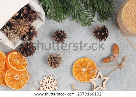 Zero waste and eco friendly christmas concept. Natural decorations and branches of a Christmas tree on the table, top view, flatlay