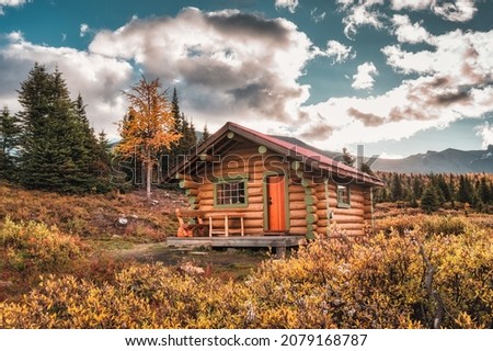Wooden hut with blue sky in autumn forest at national park Royalty-Free Stock Photo #2079168787