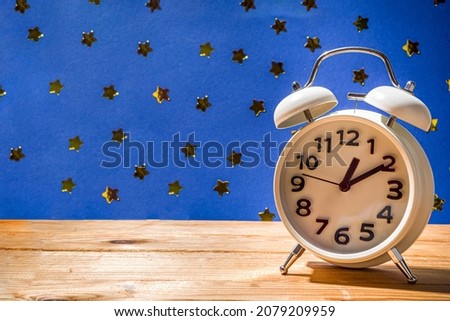 Circadian rhythms with white alarm clock, night and day backgrounds flatlay copy space