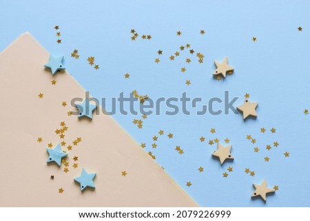 NEW YEAR and Christmas Stars background. Different colours. Christmas decoration. Symbol of holiday. Stars.Top view flatlay . background for children's party. Design of Greeting Card With 