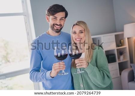 Photo of positive cheerful passionate spouses guy lady have 8-march honeymoon celebration on apartment room