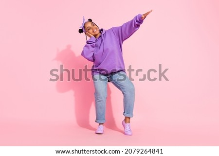 Photo of shiny attractive afro woman wear purple hoodie dancing smiling isolated pink color background