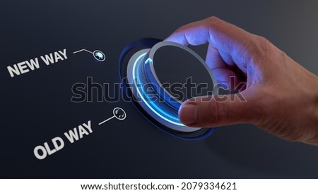 Change management concept for digital transformation or corporate organizational shift. Hand turning knob with choice between old way and new way. Forward thinking, vision and strategy. Royalty-Free Stock Photo #2079334621