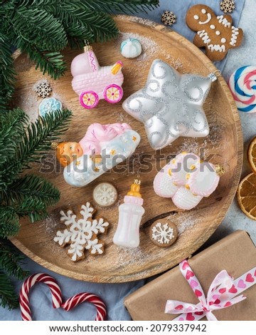 christmas baubles, toys and ornaments on wooden tray, vintage decorations. retro style toned picture