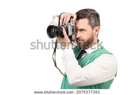 guy taking camera with retro camera isolated on white backdrop, copy space, photographing