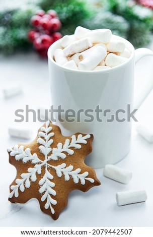 Christmas cocoa,  gingerbread cookies and decorations. White wooden background. 