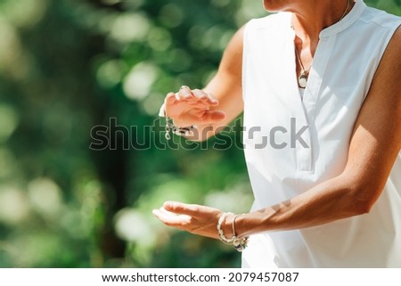 Qigong Female Master Practicing Chinese Martial Arts in Nature Royalty-Free Stock Photo #2079457087