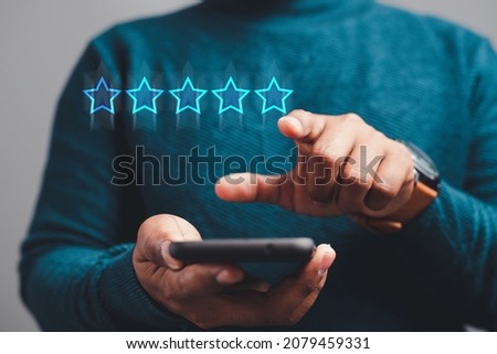 Satisfaction Survey Concept hands of business people, customer service The best 5-star business rating experience on your smartphone.
 Royalty-Free Stock Photo #2079459331
