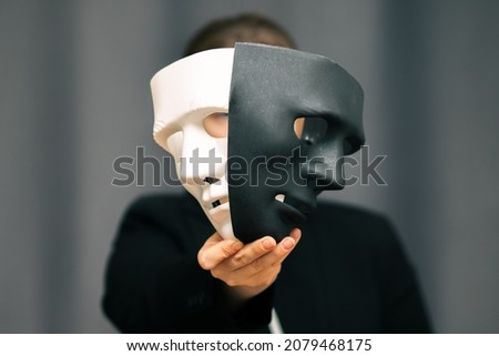 choice of personal growth and self-development, between good and bad, poor and rich, good and evil, woman with black and white masks Royalty-Free Stock Photo #2079468175